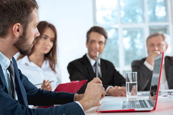 business-people-working-together-table-scaled.jpg